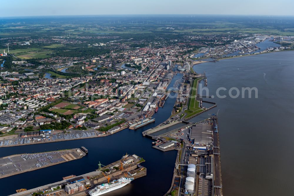 Bremerhaven from the bird's eye view: Docks and terminals with warehouses, freight forwarding and logistics companies and lots of containers by the mouth of the Weser in Bremerhaven in the state Bremen