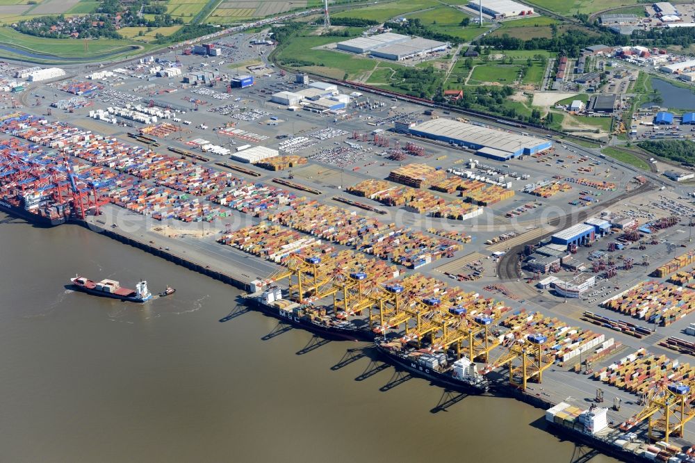 Bremerhaven from the bird's eye view: Docks and terminals with warehouses and freight forwarding and logistics companies by the mouth of the Weser in Bremerhaven in the state Bremen