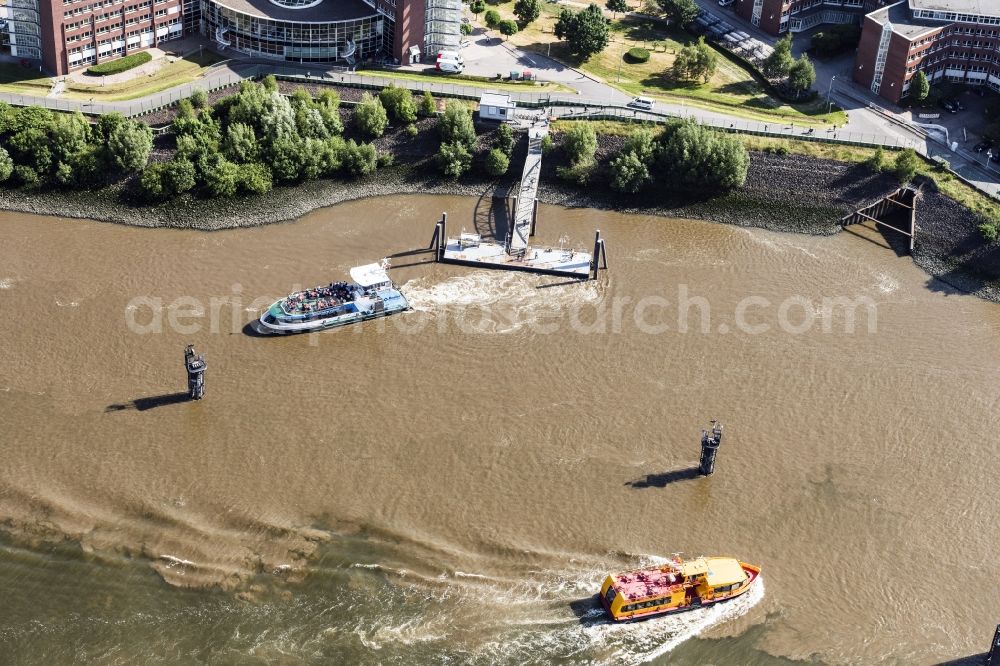 Hamburg from the bird's eye view: Port facilities on the banks of the river course of the Elbe in Hamburg, Germany