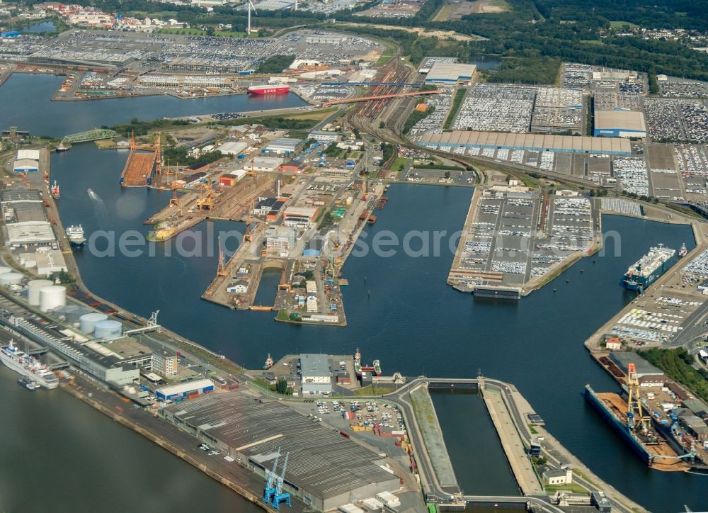 Bremerhaven from the bird's eye view: Port facilities on the shores of the harbor of Ueberseehafen in Bremerhaven in the state Bremen, Germany