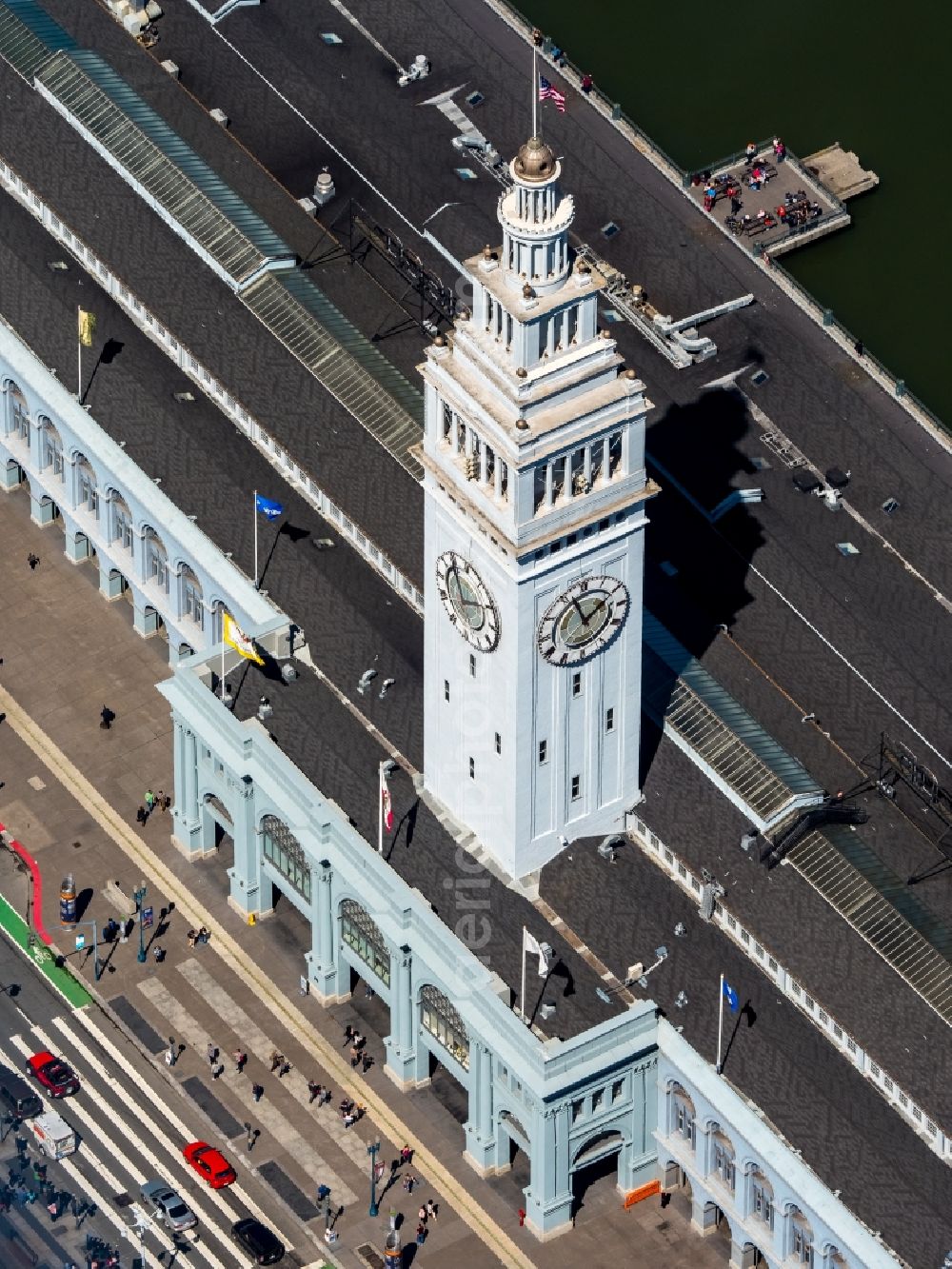 Aerial image San Francisco - Port facilities and white clock tower on the shores of the harbor of des Ferry Terminal in San Francisco in USA