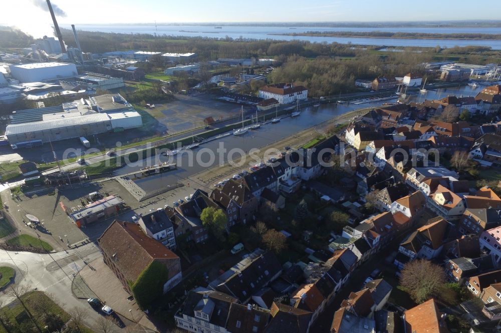 Glückstadt from above - Pleasure boat marina with docks and moorings on the shore area in Glueckstadt in the state Schleswig-Holstein