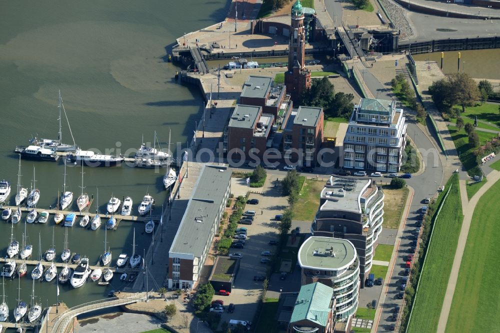 Aerial photograph Bremerhaven - Harbour and port area of Neuer Hafen and lighthouse in Bremerhaven in the state of Bremen. The lighthouse is called Bremerhaven Oberfeuer and listed as a protected building