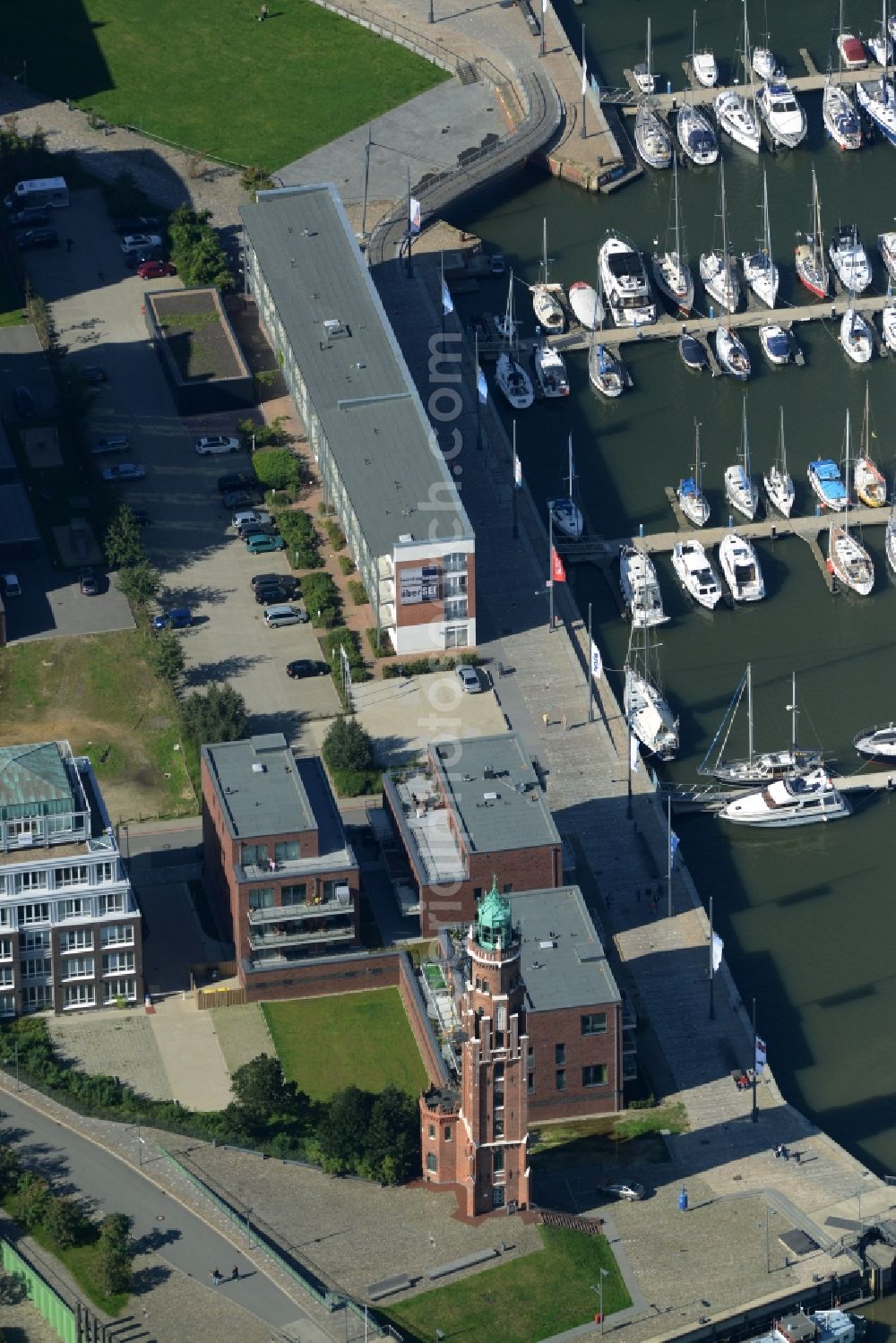 Aerial image Bremerhaven - Harbour and port area of Neuer Hafen and lighthouse in Bremerhaven in the state of Bremen. The lighthouse is called Bremerhaven Oberfeuer and listed as a protected building