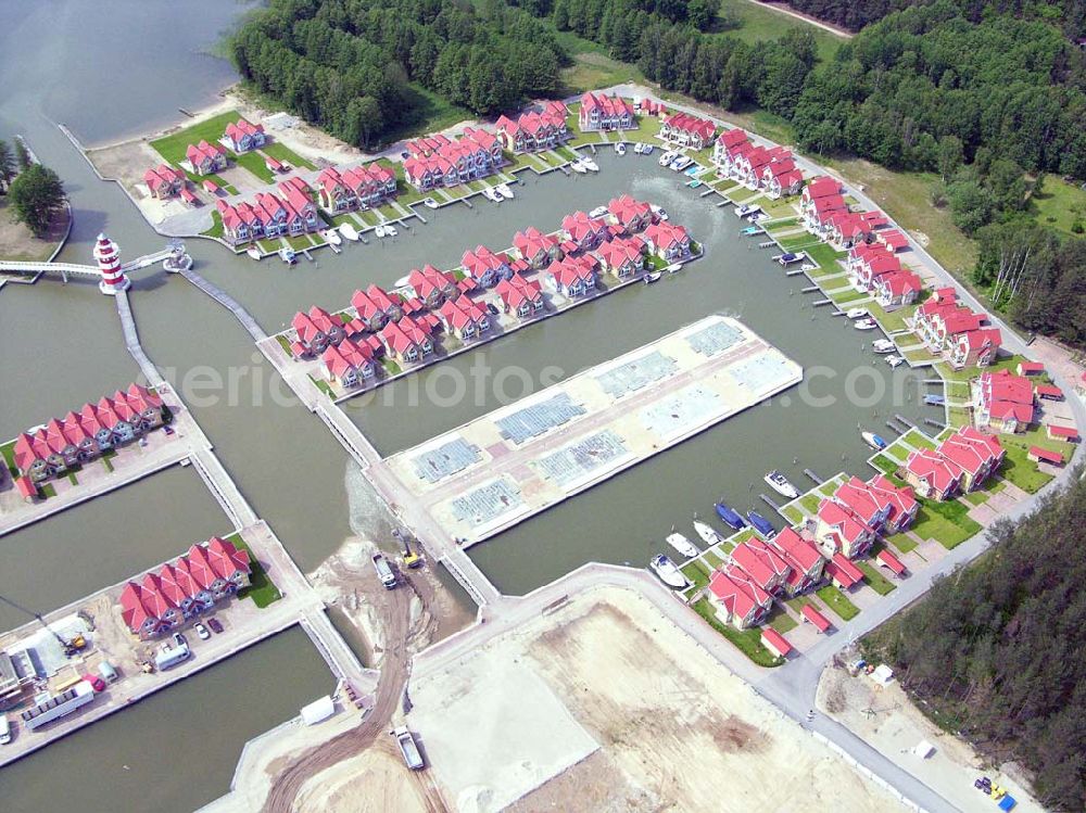 Rheinsberg from the bird's eye view: Rheinsberg / Brandenburg Blick auf das fast fertige Hafendorf Rheinsberg - Projektgesellschaft Hafendorf Rheinsberg GmbH,Lenaustr. 27,D-12305 Berlin,Telefon: +49 33931/34 161,Telefax: +49 33931/34 163,Email: info@hafendorf-rheinsberg.de,Achim Walder: