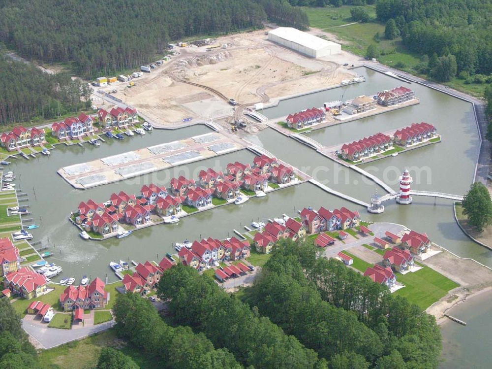 Rheinsberg from the bird's eye view: Rheinsberg / Brandenburg Blick auf das fast fertige Hafendorf Rheinsberg - Projektgesellschaft Hafendorf Rheinsberg GmbH,Lenaustr. 27,D-12305 Berlin,Telefon: +49 33931/34 161,Telefax: +49 33931/34 163,Email: info@hafendorf-rheinsberg.de,Achim Walder: