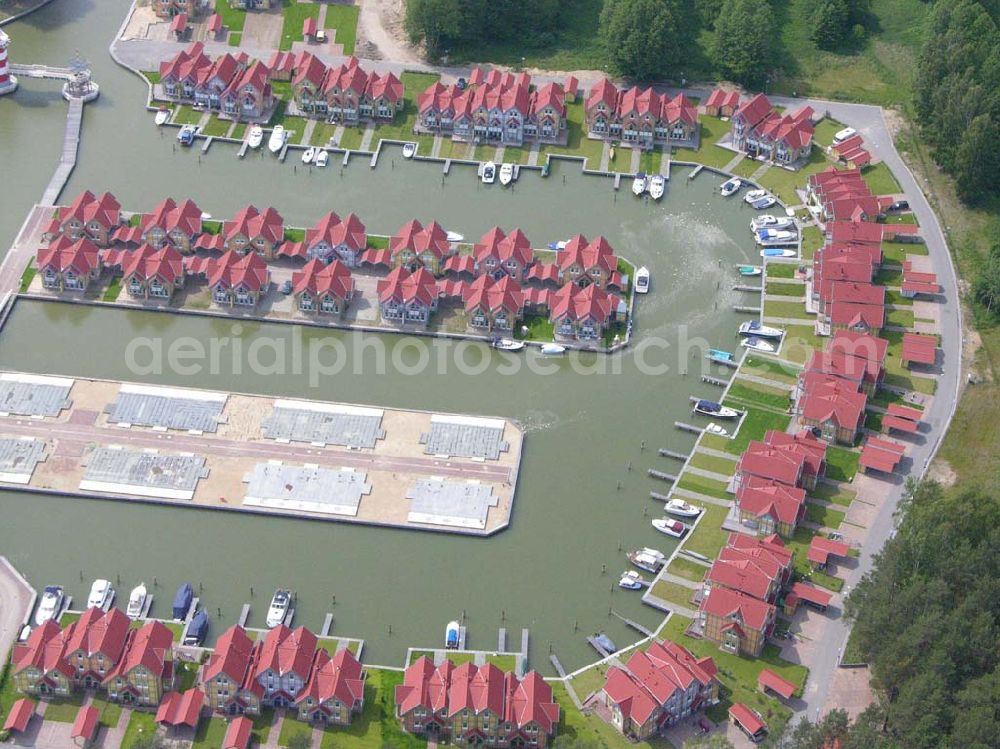 Rheinsberg from the bird's eye view: Rheinsberg / Brandenburg Blick auf das fast fertige Hafendorf Rheinsberg - Projektgesellschaft Hafendorf Rheinsberg GmbH,Lenaustr. 27,D-12305 Berlin,Telefon: +49 33931/34 161,Telefax: +49 33931/34 163,Email: info@hafendorf-rheinsberg.de,Achim Walder: