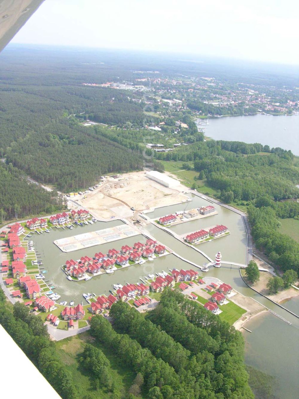 Aerial photograph Rheinsberg - Rheinsberg / Brandenburg Blick auf das fast fertige Hafendorf Rheinsberg - Projektgesellschaft Hafendorf Rheinsberg GmbH,Lenaustr. 27,D-12305 Berlin,Telefon: +49 33931/34 161,Telefax: +49 33931/34 163,Email: info@hafendorf-rheinsberg.de,Achim Walder: