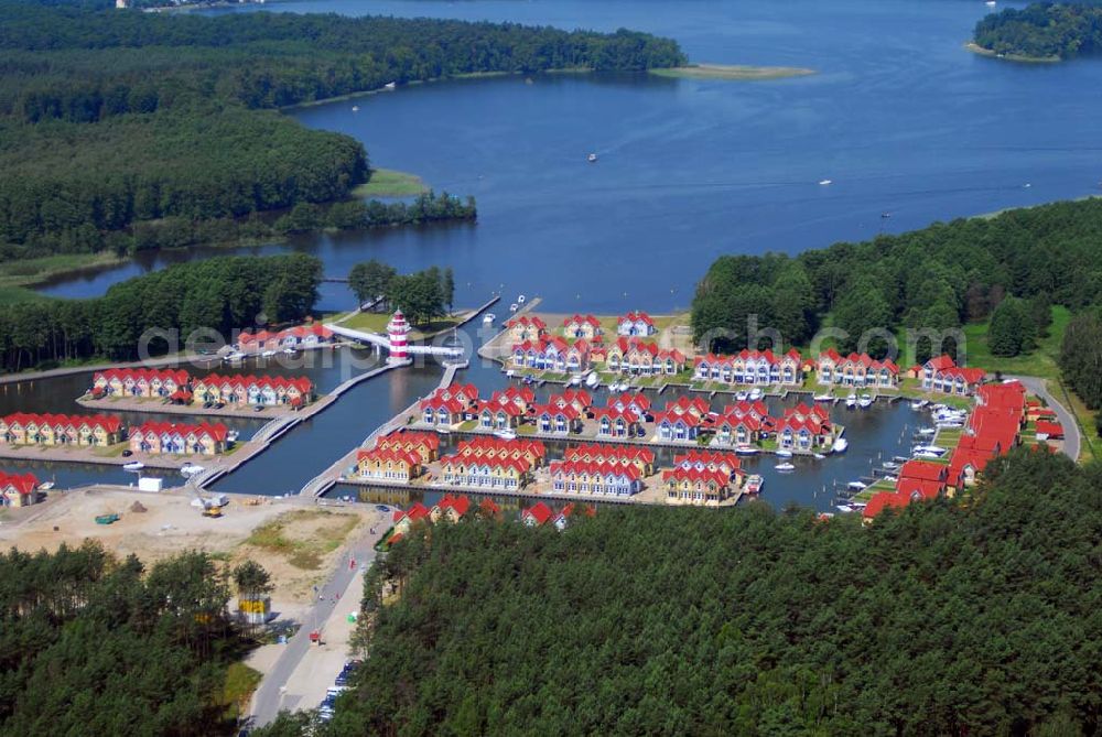 Rheinsberg from the bird's eye view: Blick auf das fast fertige Hafendorf Rheinsberg - Projektgesellschaft Hafendorf Rheinsberg GmbH,Lenaustr. 27,D-12305 Berlin,Telefon: +49 33931/34 161,Telefax: +49 33931/34 163,Email: info@hafendorf-rheinsberg.de,Achim Walder: