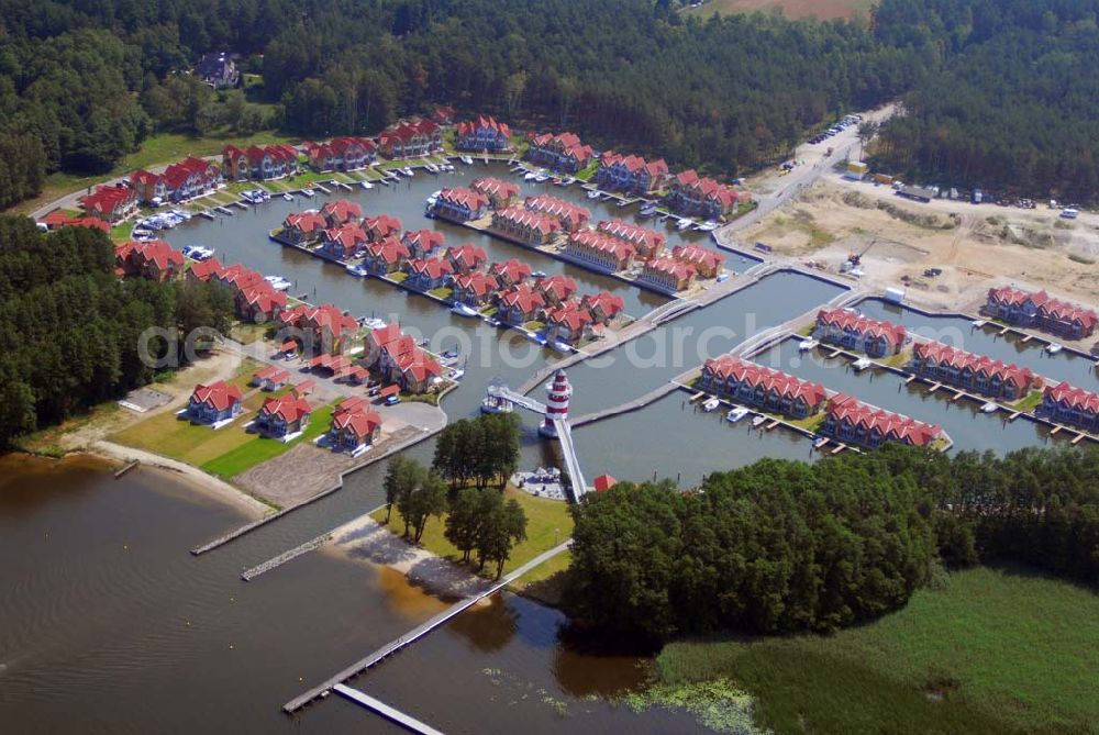 Rheinsberg from the bird's eye view: Blick auf das fast fertige Hafendorf Rheinsberg - Projektgesellschaft Hafendorf Rheinsberg GmbH,Lenaustr. 27,D-12305 Berlin,Telefon: +49 33931/34 161,Telefax: +49 33931/34 163,Email: info@hafendorf-rheinsberg.de,Achim Walder: