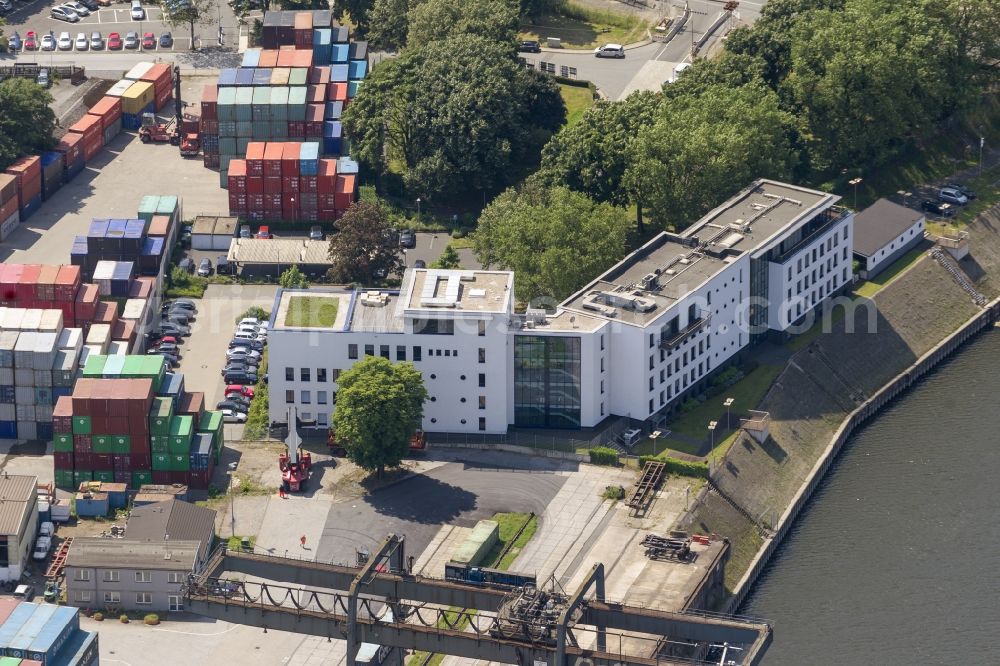 Duisburg from above - View of the port of Duisburg in the state North Rhine-Westphalia.On display are various transportable containers at the port channel and the freight railroad tracks