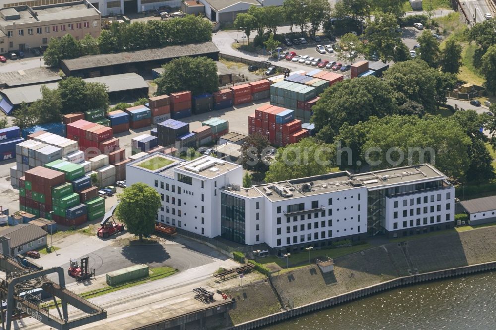 Duisburg from the bird's eye view: View of the port of Duisburg in the state North Rhine-Westphalia.On display are various transportable containers at the port channel and the freight railroad tracks