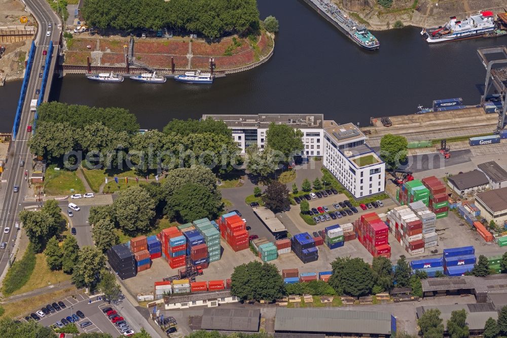 Duisburg from above - View of the port of Duisburg in the state North Rhine-Westphalia.On display are various transportable containers at the port channel and the freight railroad tracks