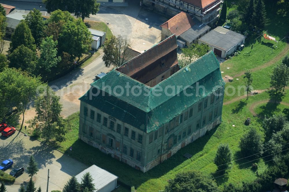 Langenleuba-Niederhain from the bird's eye view: Halbes Schloss Castle in the village centre of Langenleuba-Niederhain in the state of Thuringia. The historic building is being renovated