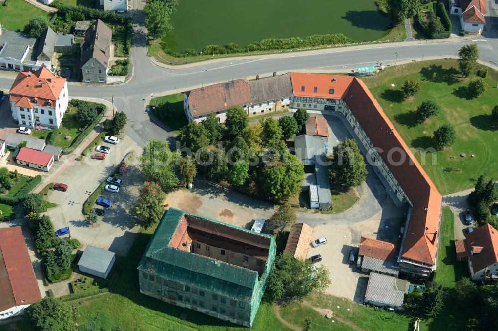 Langenleuba-Niederhain from the bird's eye view: Halbes Schloss Castle in the village centre of Langenleuba-Niederhain in the state of Thuringia. The historic building is being renovated