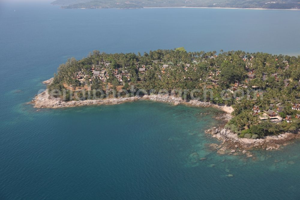 Choeng Thale from the bird's eye view: Peninsula at Choeng Thale on the island of Phuket in Thailand. On it is located the Amanpuri Resort, a luxury hotel under palm trees