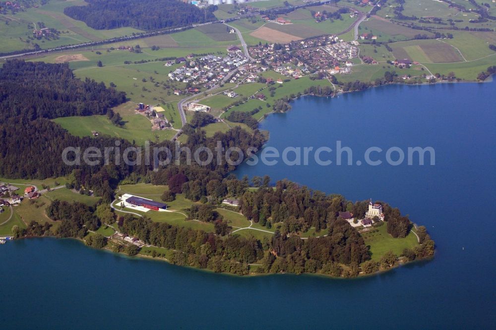 Aerial image Buonas - Idyllic situated in the Lake Zug is the Buonas peninsula in Risch in Switzerland. Castle Buonas and Forum Buonas, the training center and conference center of the pharmaceutical company Rocheare located in an expansive parkland