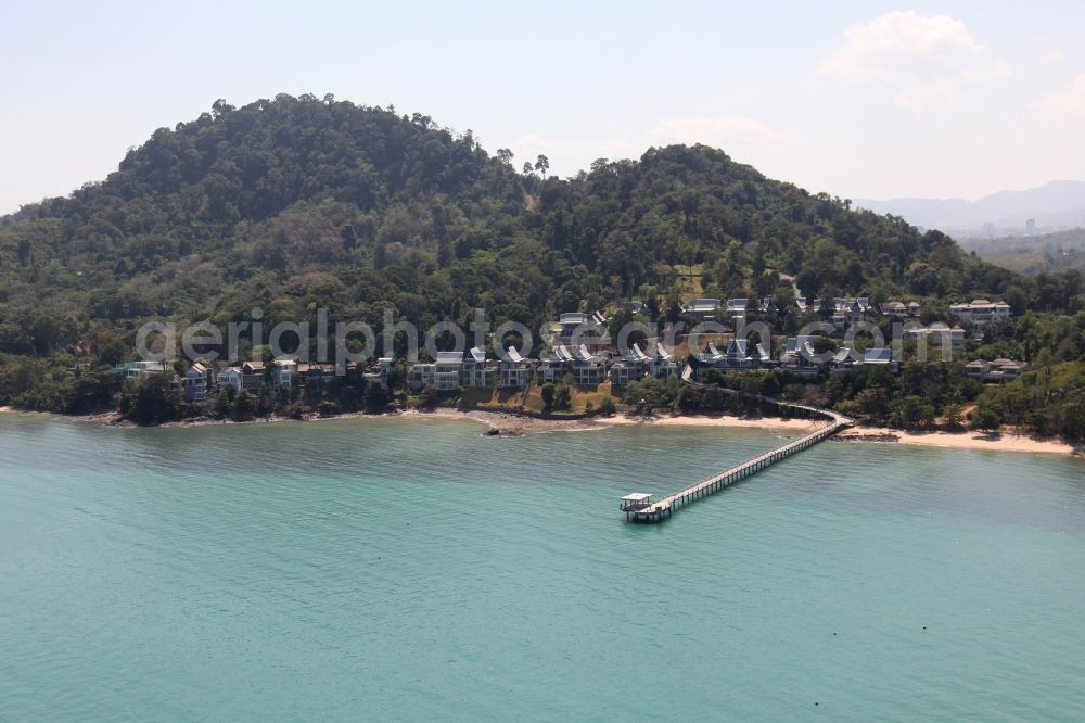 Ratsada from above - The Ko Sire Peninsula is on the eastern edge of the island of Phuket in Thailand, with villas, hotels and pier on the beach