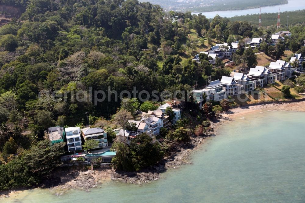 Ratsada from the bird's eye view: The Ko Sire Peninsula is on the eastern edge of the island of Phuket in Thailand, with villas, hotels and pier on the beach