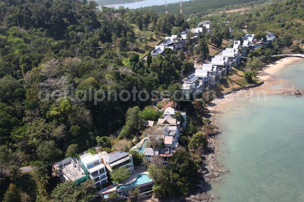 Aerial image Ratsada - The Ko Sire Peninsula is on the eastern edge of the island of Phuket in Thailand, with villas, hotels and pier on the beach