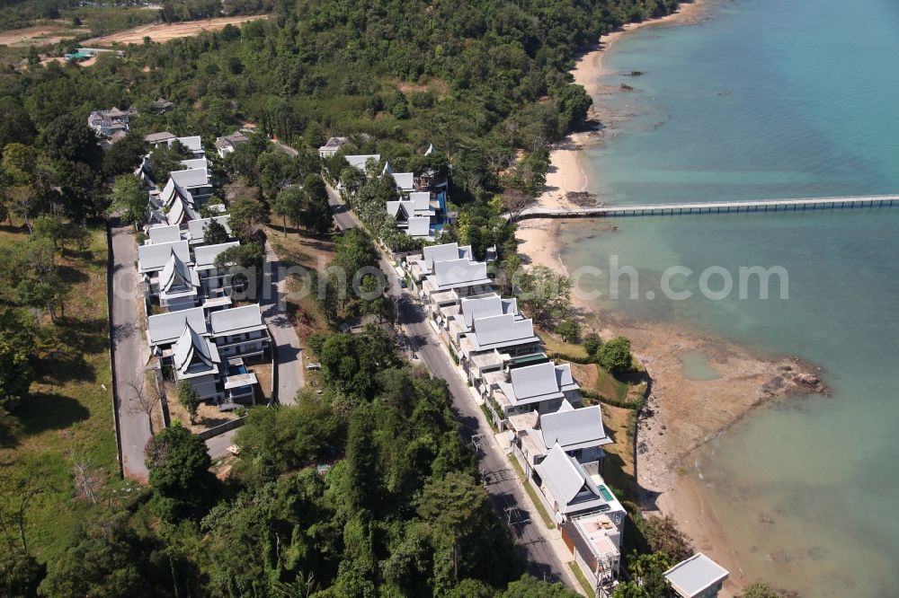 Aerial photograph Ratsada - The Ko Sire Peninsula is on the eastern edge of the island of Phuket in Thailand, with villas, hotels and pier on the beach