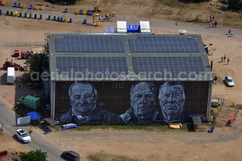 Gräfenhainichen from the bird's eye view: View of the halls of the City of Iron - Ferropolis. On their glass fronts are graffitis of former miners, as a part of the artwork entitled Spuren by Hendrik Beikirch alias ecb