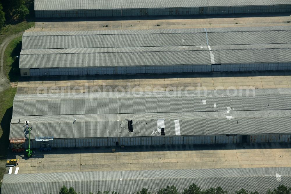 Grünheide (Mark) from above - Industrial and commercial area in the Hangelsberg part of the borough of Gruenheide (Mark) in the state of Brandenburg. The site includes several large halls as well as industrial and office buildings