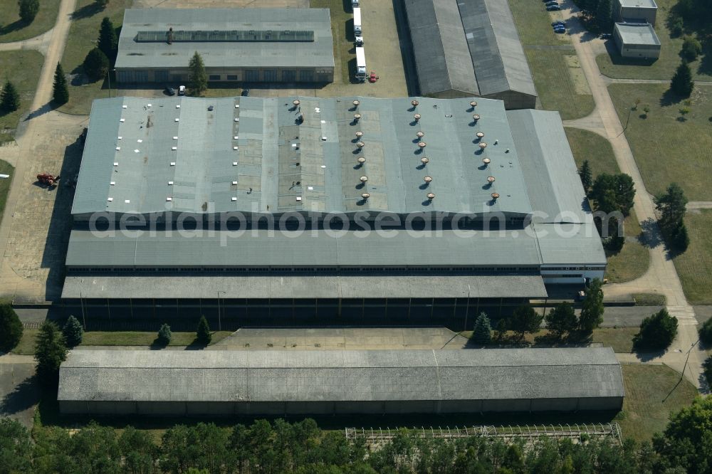 Aerial photograph Grünheide (Mark) - Industrial and commercial area in the Hangelsberg part of the borough of Gruenheide (Mark) in the state of Brandenburg. The site includes several large halls as well as industrial and office buildings