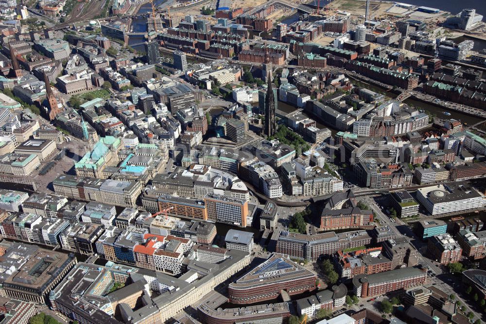 Hamburg from the bird's eye view: View of downtowan Hamburg with the Speicherstadt in the background, the remains of the old St. Nicolai church in the center and the city hall on the left