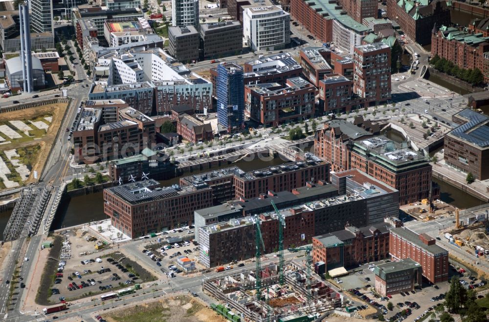 Hamburg from the bird's eye view: View of a developing area in the district Hafencity at the port of Magdeburg and the Magdeburg bridge in the Hanseatic city of Hamburg at the port of Hamburg