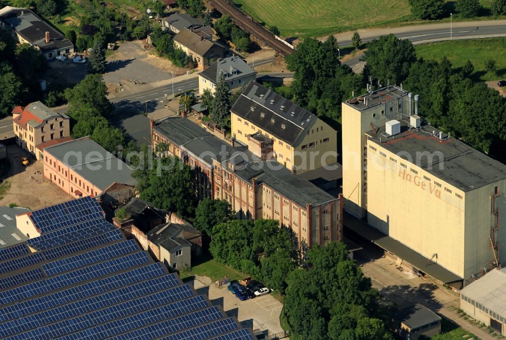 Gera from above - In the Zoitzstrasse of Gera in Thuringia the HaGeVa trade and grain processing mbH has its place. On the industrial area in Liebschwitz other companies such as lighting and electrical treasure their establishment. On a factory or warehouse solar panels are mounted