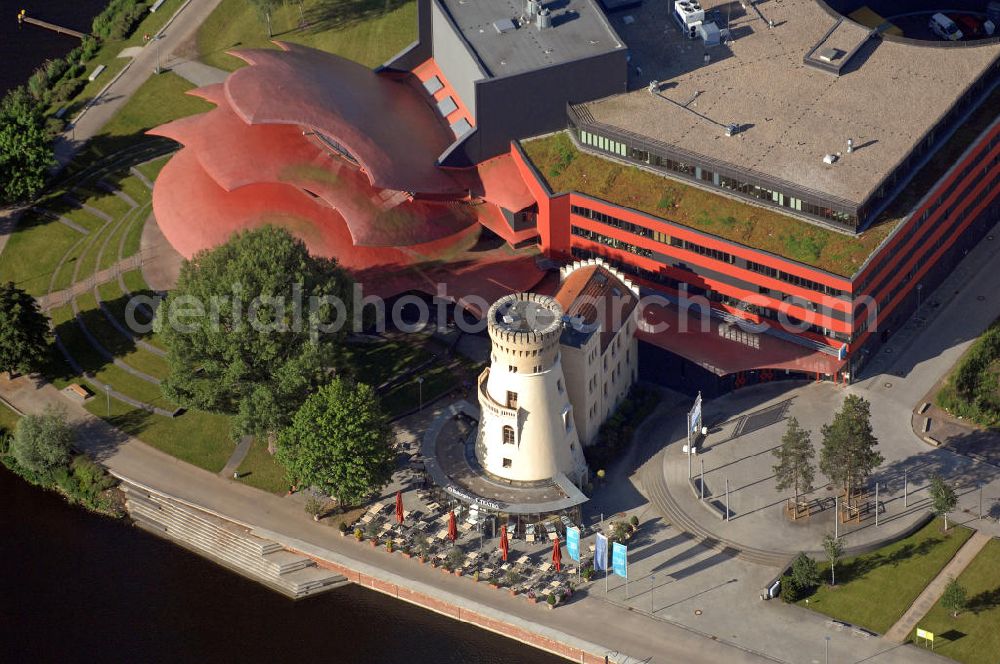 Potsdam from above - Blick auf das Hans Otto Theater auf dem Kultur- und Gewerbestandort in der Schiffbauergasse am Tiefen See in Potsdam. Das 2006 eröffnete Theater ist das Brandenburgischen Landestheaters, das nach dem Vorbild des Sydney Opera House vom Architekten Gottfried Böhm entworfen wurde. Vor dem Neubau steht der aus dem 19. Jahrhundert stammende Turm einer früheren Zichorienmühle, in dem ein Restaurant für gehobene Ansprüche untergebracht ist. View of the Hans Otto Theatre in the cultural and business center in the Schiffbauergasse on the lake Tiefer See in Potsdam. Opened in 2006, the Theatre is the Brandenburg State Theater, designed along the lines of the Sydney Opera House by the architect Gottfried Böhm.