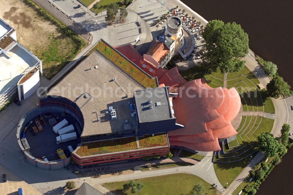 Aerial image Potsdam - Blick auf das Hans Otto Theater auf dem Kultur- und Gewerbestandort in der Schiffbauergasse am Tiefen See in Potsdam. Das 2006 eröffnete Theater ist das Brandenburgischen Landestheaters, das nach dem Vorbild des Sydney Opera House vom Architekten Gottfried Böhm entworfen wurde. Vor dem Neubau steht der aus dem 19. Jahrhundert stammende Turm einer früheren Zichorienmühle, in dem ein Restaurant für gehobene Ansprüche untergebracht ist. View of the Hans Otto Theatre in the cultural and business center in the Schiffbauergasse on the lake Tiefer See in Potsdam. Opened in 2006, the Theatre is the Brandenburg State Theater, designed along the lines of the Sydney Opera House by the architect Gottfried Böhm.