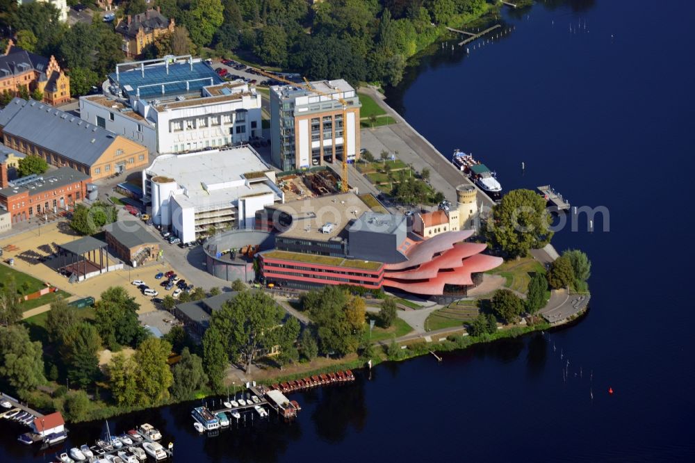 Aerial image Potsdam - Blick auf das Hans Otto Theater auf dem Kultur- und Gewerbestandort in der Schiffbauergasse am Ufer des Tiefen Sees in Potsdam. Das 2006 eröffnete Theater ist das Brandenburgischen Landestheaters, das vom Architekten Gottfried Böhm entworfen wurde. Vor dem Neubau steht der aus dem 19. Jahrhundert stammende Turm einer früheren Zichorienmühle, in dem ein Restaurant für gehobene Ansprüche untergebracht ist.