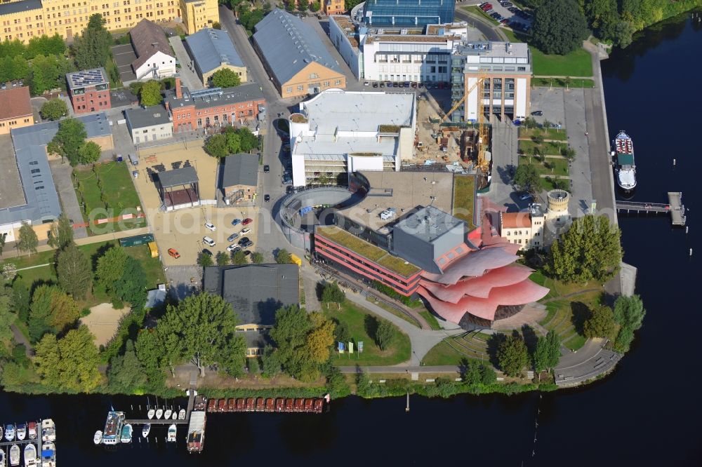 Potsdam from above - Blick auf das Hans Otto Theater auf dem Kultur- und Gewerbestandort in der Schiffbauergasse am Ufer des Tiefen Sees in Potsdam. Das 2006 eröffnete Theater ist das Brandenburgischen Landestheaters, das vom Architekten Gottfried Böhm entworfen wurde. Vor dem Neubau steht der aus dem 19. Jahrhundert stammende Turm einer früheren Zichorienmühle, in dem ein Restaurant für gehobene Ansprüche untergebracht ist.