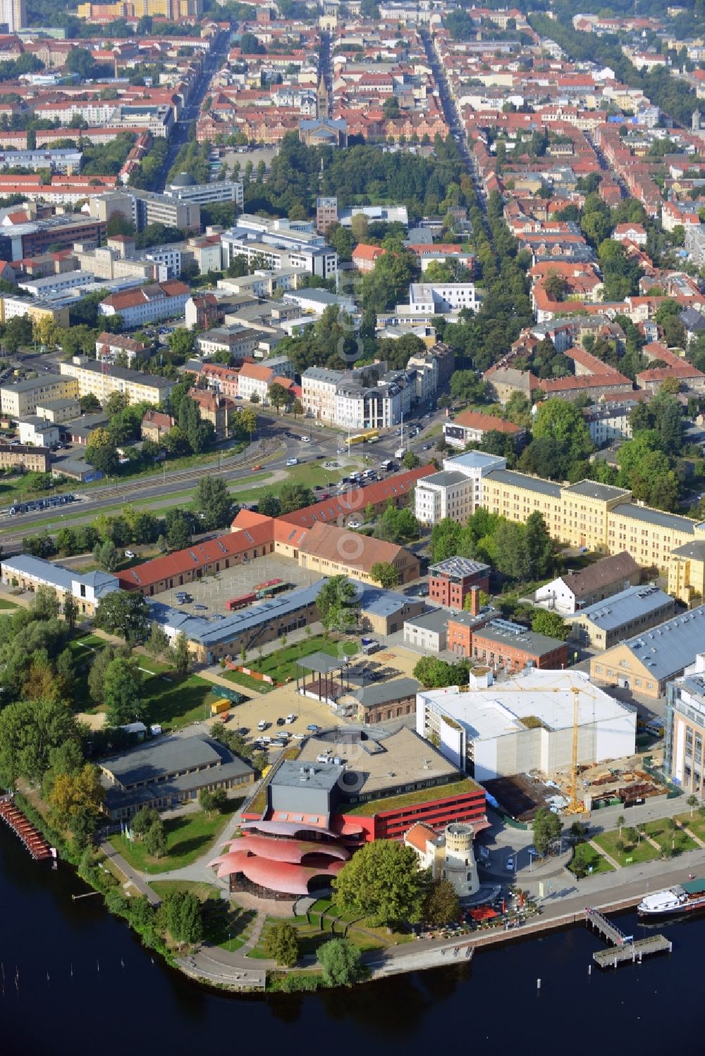 Aerial image Potsdam - Blick auf das Hans Otto Theater auf dem Kultur- und Gewerbestandort in der Schiffbauergasse am Ufer des Tiefen Sees in Potsdam. Das 2006 eröffnete Theater ist das Brandenburgischen Landestheaters, das vom Architekten Gottfried Böhm entworfen wurde. Vor dem Neubau steht der aus dem 19. Jahrhundert stammende Turm einer früheren Zichorienmühle, in dem ein Restaurant für gehobene Ansprüche untergebracht ist.