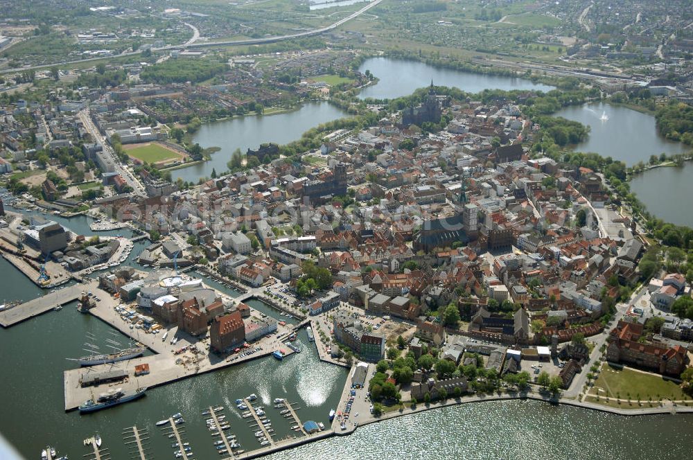 Aerial photograph Stralsund - Blick auf die Hansestadt Stralsund, eine kreisfreie Stadt in Mecklenburg-Vorpommern im Norden Deutschlands. Die Stadt liegt am Strelasund, einer Meerenge der Ostsee, und wird auf Grund ihrer Lage als Tor zur Insel Rügen bezeichnet. Die Stadt ist zusammen mit Greifswald eines der vier Oberzentren des Landes. Die Altstadt gehört seit 2002 zum UNESCO-Weltkulturerbe.