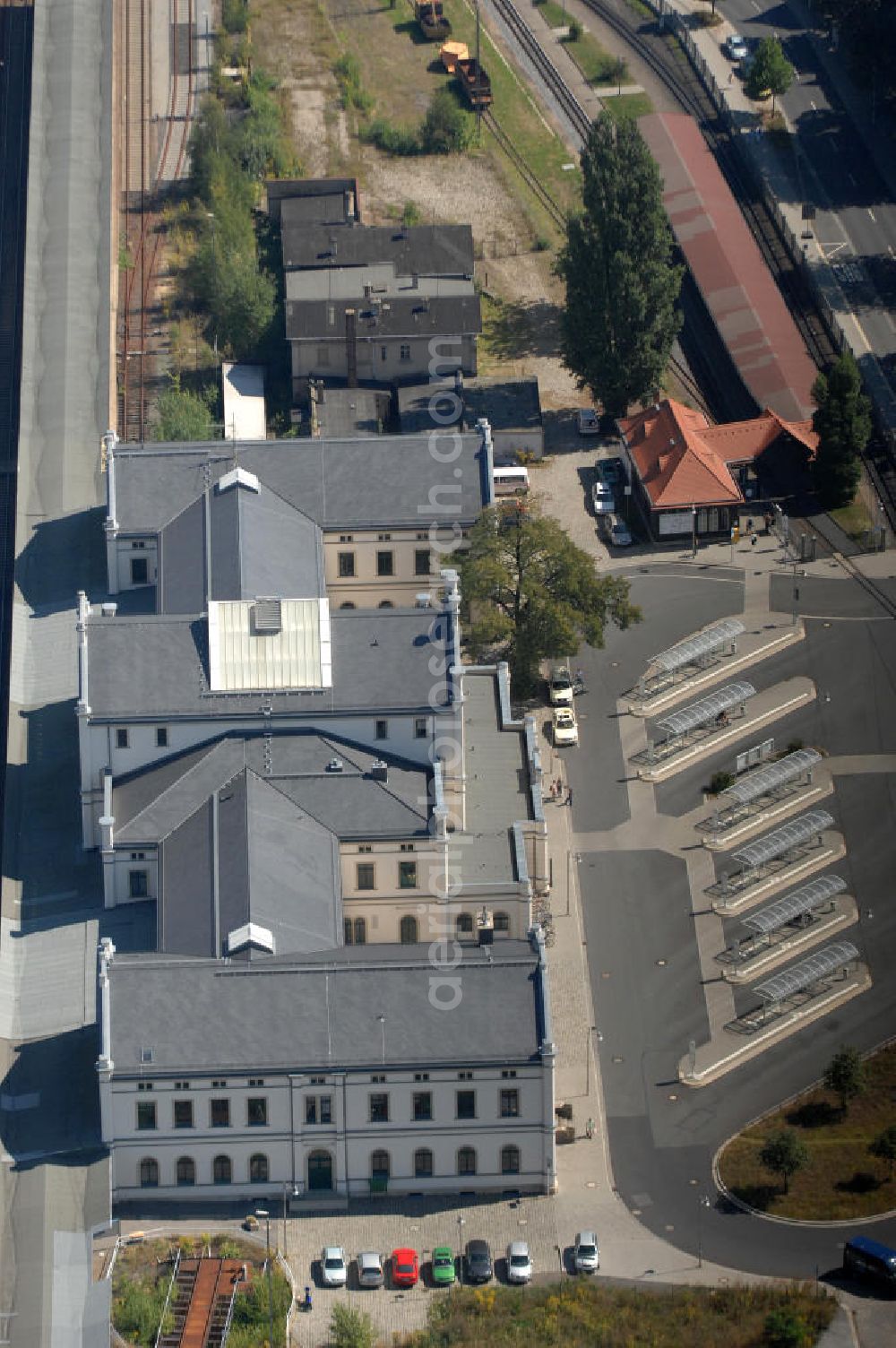 Aerial image Zittau - Blick auf den Zittauer Hauptbahnhof in Sachsen. Zittau liegt in der Oberlausitz und ist eine Große Kreisstadt im Landkreis Görlitz. Der große Zittauer Bahnhof zeigt sich in einem schönen klassizistischen Stil. Der Hauptbahnhof Zittau wurde im Jahr 1859 eröffnet und im Jahr 2001 umfangreich saniert. Außerdem ist der Bahnhof seit 1890 Ausgangspunkt der Zittau-Oybin-Jonsdorfer-Eisenbahn (ZOJE), auch bekannt als 'Zittauer Schmalspurbahn'. Kontakt: Sächsisch-Oberlausitzer Eisenbahngesellschaft mbH, Tel. +49 035 83 54 05 40,