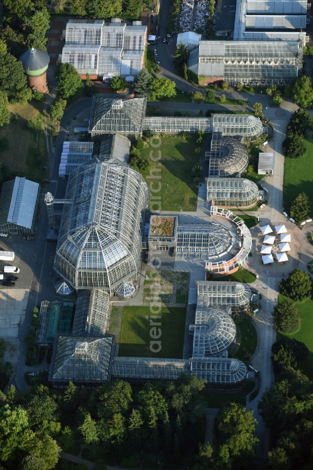 Aerial image Berlin - Main building and greenhouse complex of the Botanical Gardens Berlin-Dahlem in Berlin. The historical glass buildings and greenhouses are dedicated to different areas. The Large Tropical House and the Victoria-House are located in the center