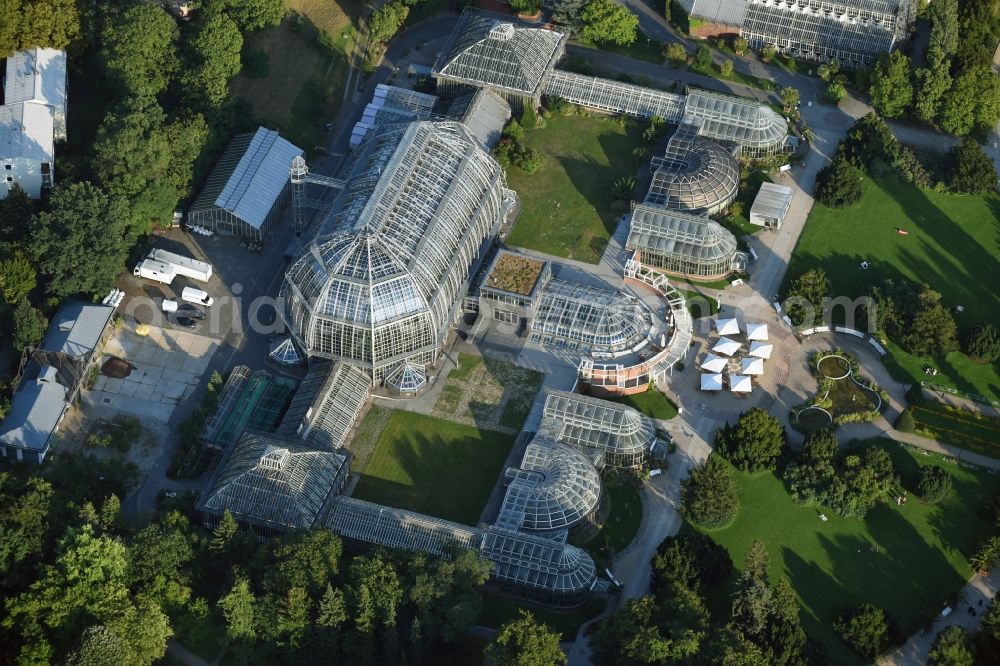 Berlin from above - Main building and greenhouse complex of the Botanical Gardens Berlin-Dahlem in Berlin. The historical glass buildings and greenhouses are dedicated to different areas. The Large Tropical House and the Victoria-House are located in the center