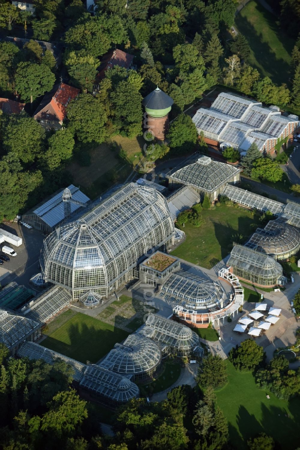 Aerial image Berlin - Main building and greenhouse complex of the Botanical Gardens Berlin-Dahlem in Berlin. The historical glass buildings and greenhouses are dedicated to different areas. The Large Tropical House and the Victoria-House are located in the center
