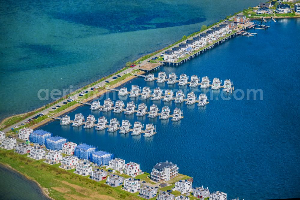 Kappeln from above - House boat berths and moorings Schwimmende Haeuser on the shore area on Schleidamm in the district OstseeResort in Kappeln in the state Schleswig-Holstein, Germany