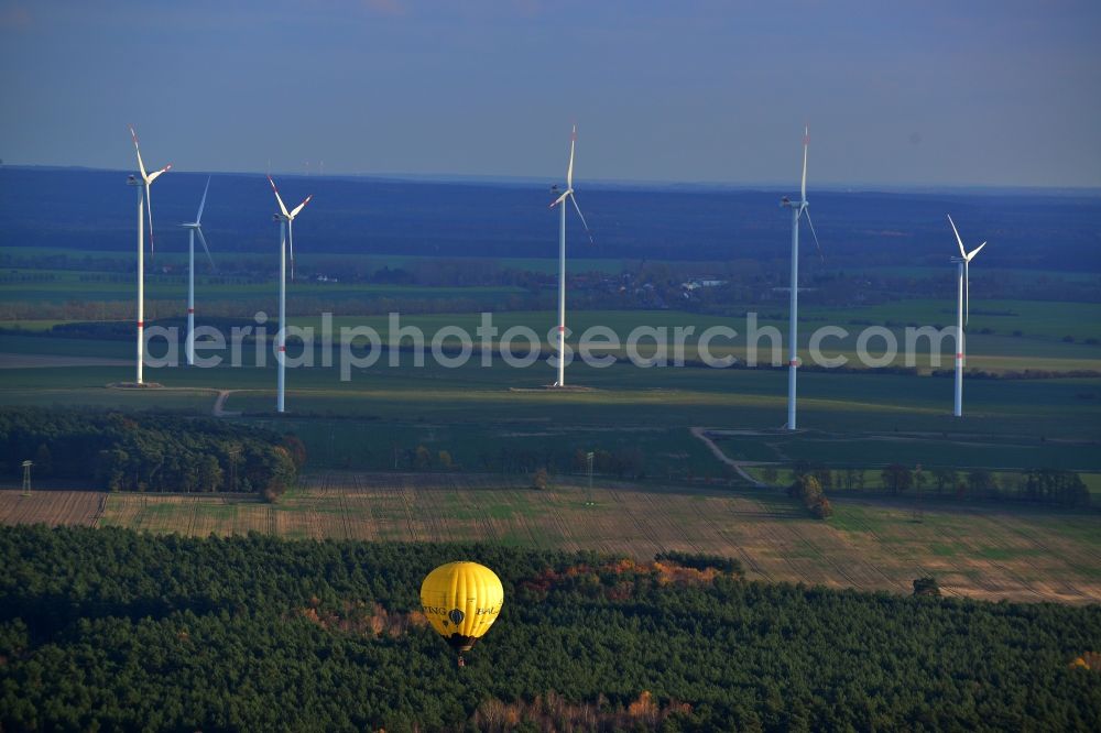 Biesenthal from above - Hot air balloon over an autumnal forest at Biesenthal in Saxony-Anhalt