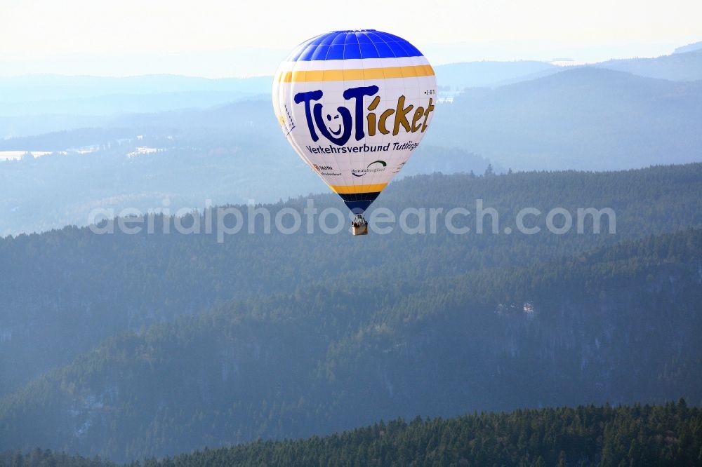 Aerial image Schluchsee - Over the winter landscape in the area of Schluchsee in the Black Forest is a hot air balloon and advertises Tuttlingen in Baden-Wuerttemberg