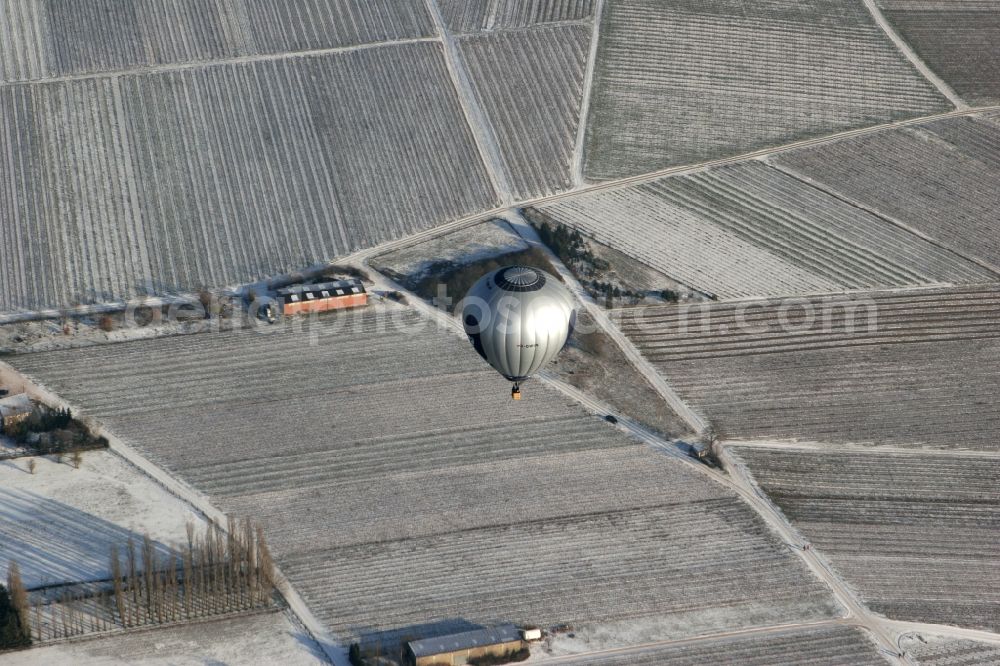 Winzenheim from above - Hot air balloon over winter covered with snow field landscape on the outskirts of Winzenheim, a district of Bad Kreuznach in Rhineland-Palatinate