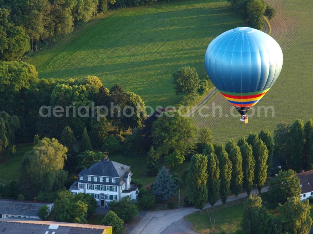 Hoholz from the bird's eye view: Hot air balloon flying over the airspace in Hoholz in the state North Rhine-Westphalia, Germany