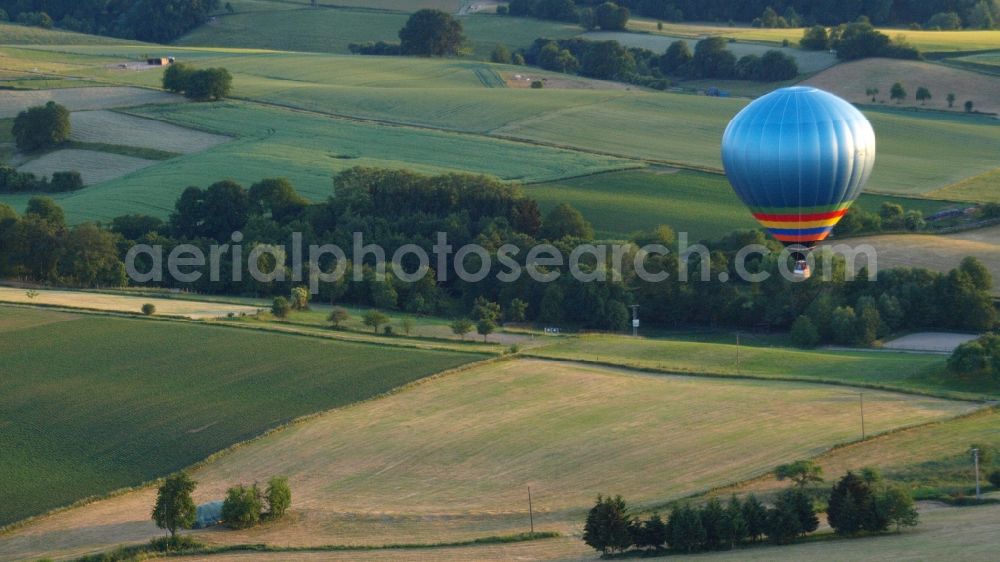 Hoholz from the bird's eye view: Hot air balloon flying over the airspace in Hoholz in the state North Rhine-Westphalia, Germany