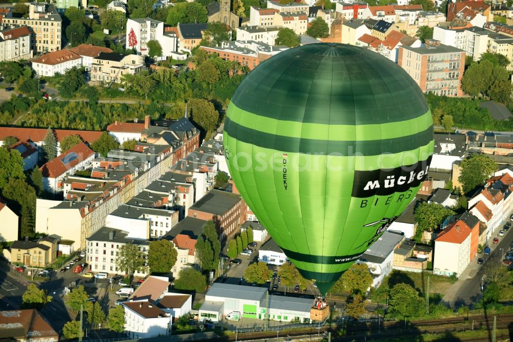 Aerial photograph Magdeburg - Hot air balloon with of Kennung D-OEKY Mueckenwirt flying in the airspace in Magdeburg in the state Saxony-Anhalt, Germany