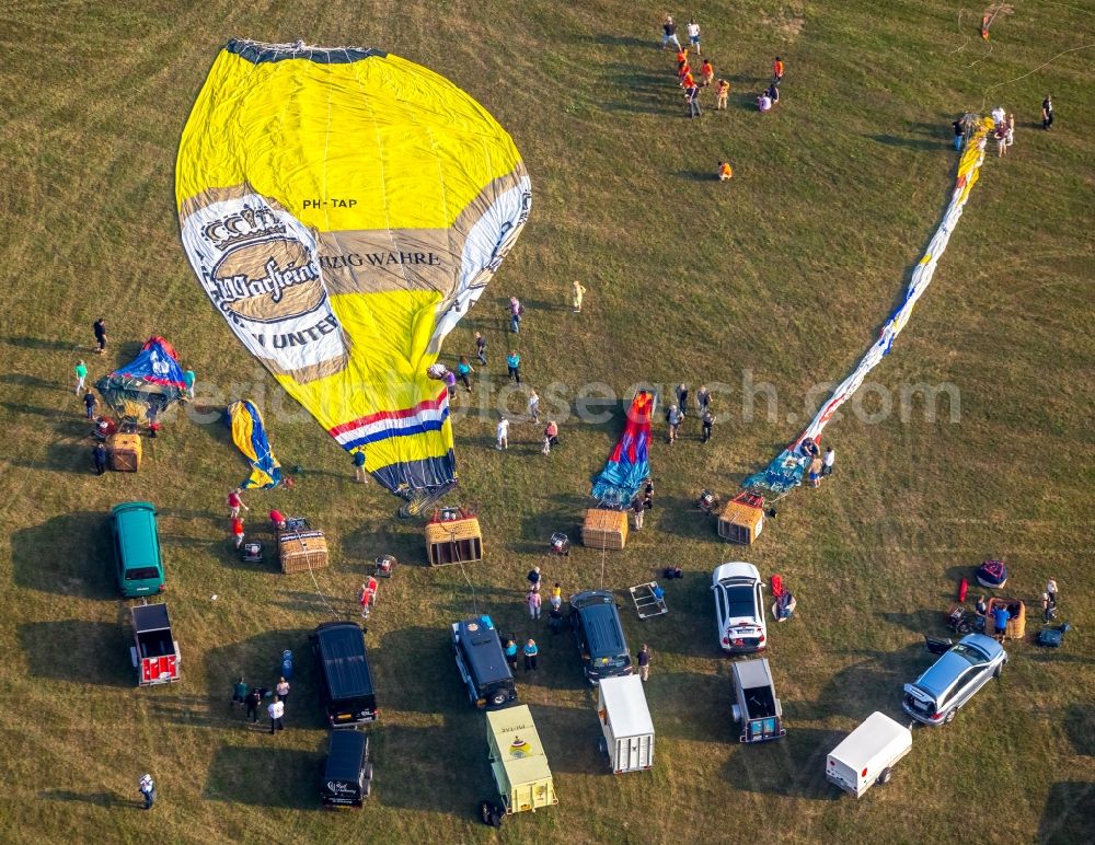 Warstein from the bird's eye view: Hot air balloon Warsteiner Montgolfiade flying over the airspace in Warstein in the state North Rhine-Westphalia, Germany