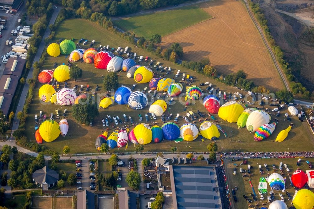 Warstein from the bird's eye view: Hot air balloon Warsteiner Montgolfiade flying over the airspace in Warstein in the state North Rhine-Westphalia, Germany